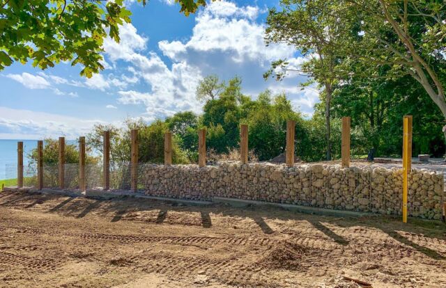 Day 1 in the books. 140 long x 6 tall Gabion Stone Fence underway. Were using imported large format Riverstone for the cage fill and baskets from Gabion Stone Canada.